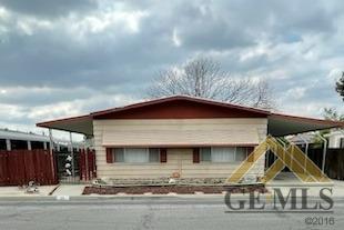 Undisclosed Address Bakersfield, CA 93308 - Photo 2 of 40 a view of a house with a porch