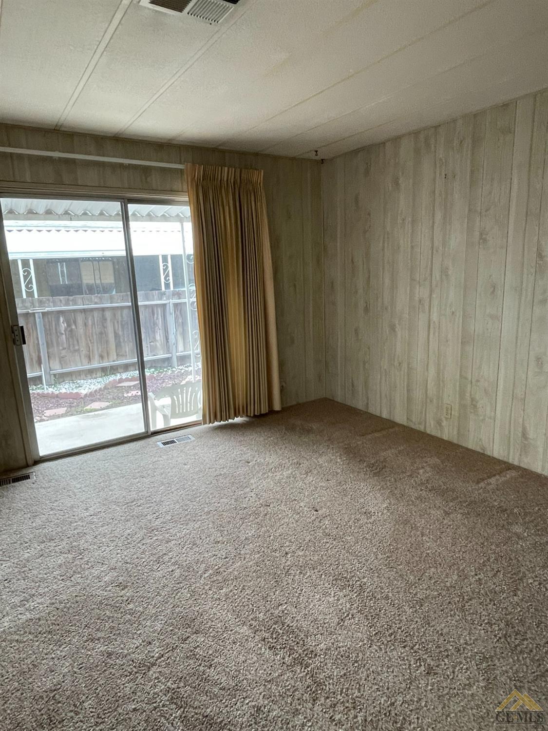 Undisclosed Address Bakersfield, CA 93308 - Photo 23 of 40 a view of an empty room with a window