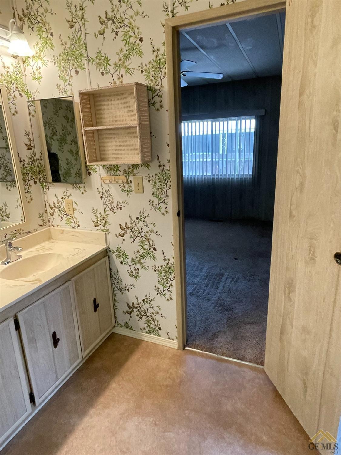 Undisclosed Address Bakersfield, CA 93308 - Photo 27 of 40 a bathroom with a sink and a mirror