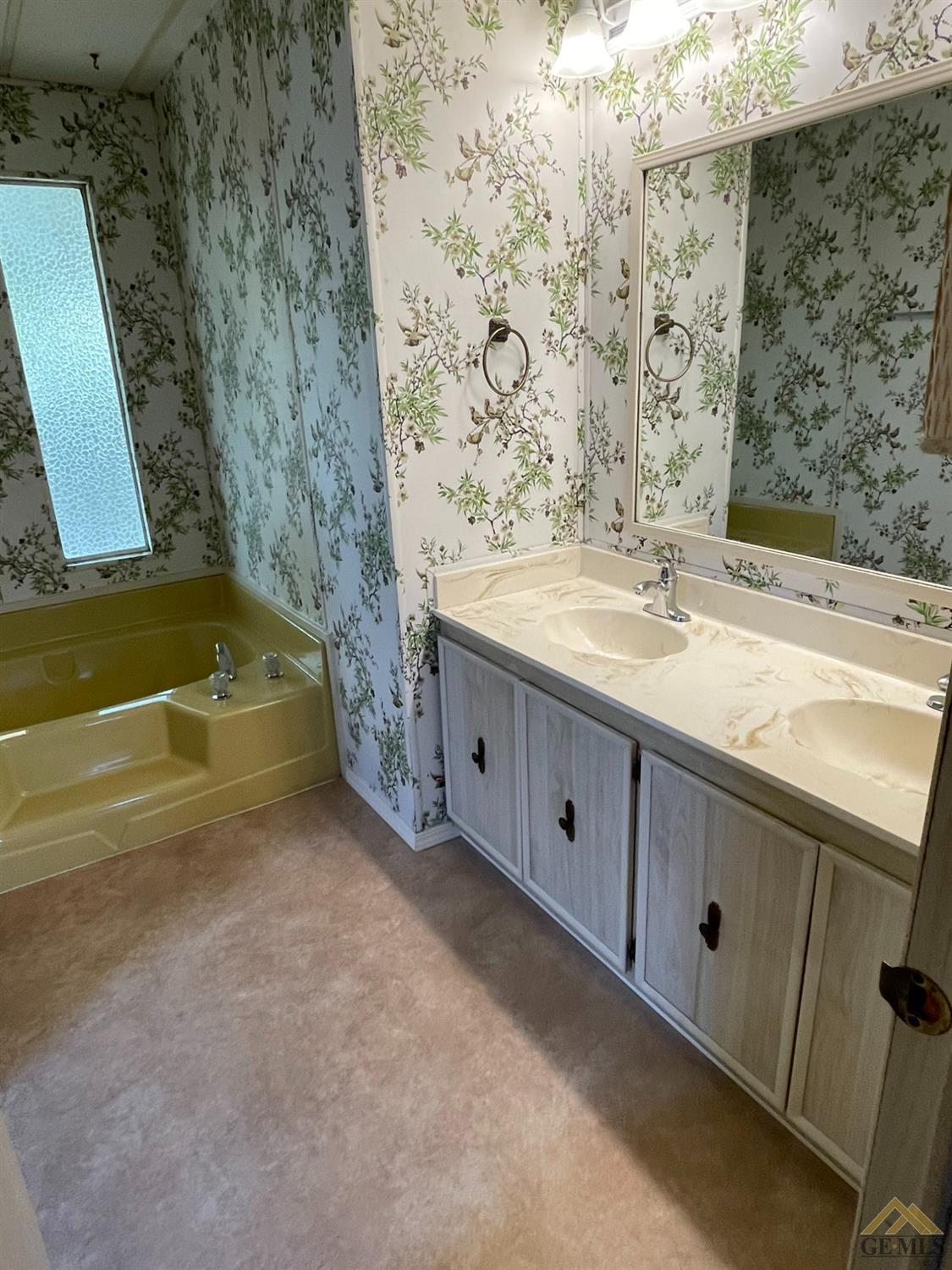 Undisclosed Address Bakersfield, CA 93308 - Photo 28 of 40 a bathroom with a sink and a mirror