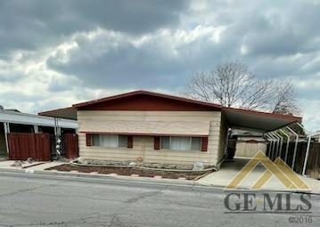 Undisclosed Address Bakersfield, CA 93308 - Photo 3 of 40 a view of a house with a yard