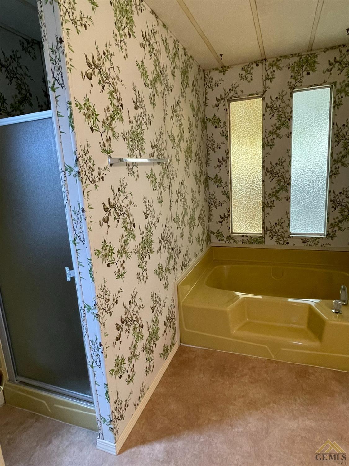 Undisclosed Address Bakersfield, CA 93308 - Photo 31 of 40 a bathroom with a bathtub and shower
