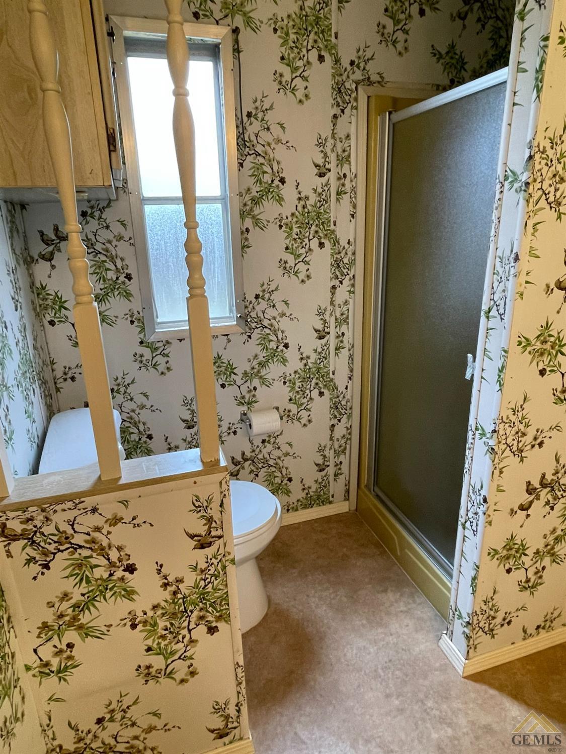 Undisclosed Address Bakersfield, CA 93308 - Photo 32 of 40 a bathroom with a sink and a shower curtain