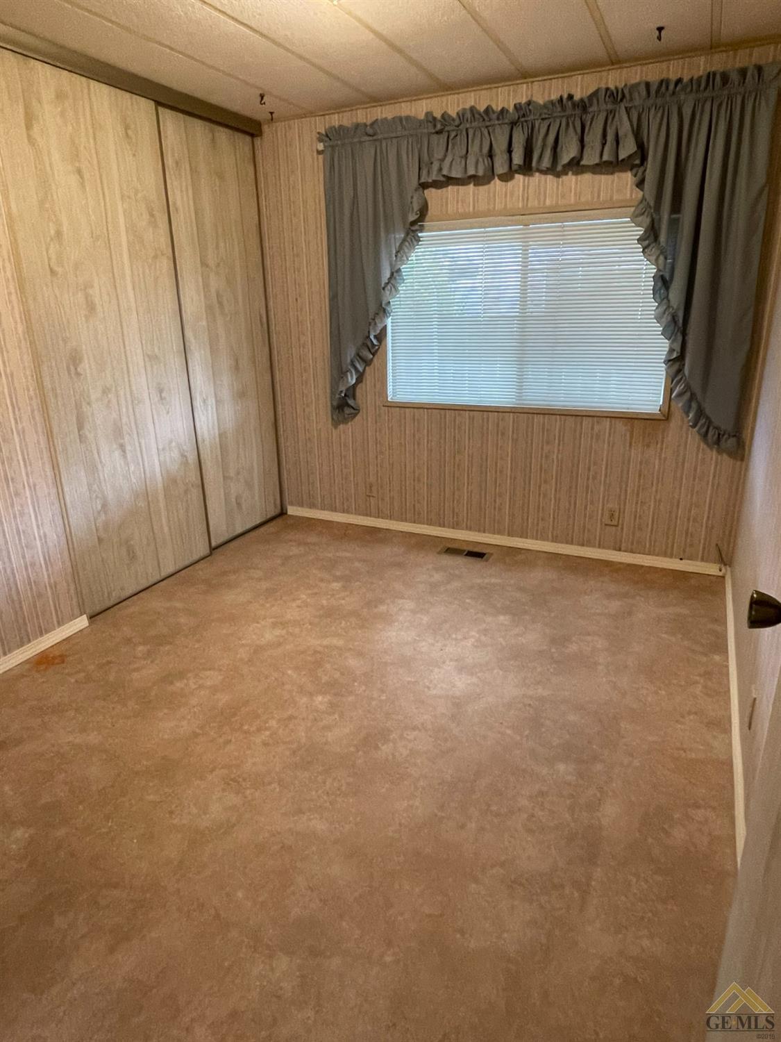 Undisclosed Address Bakersfield, CA 93308 - Photo 36 of 40 a view of an empty room with a window