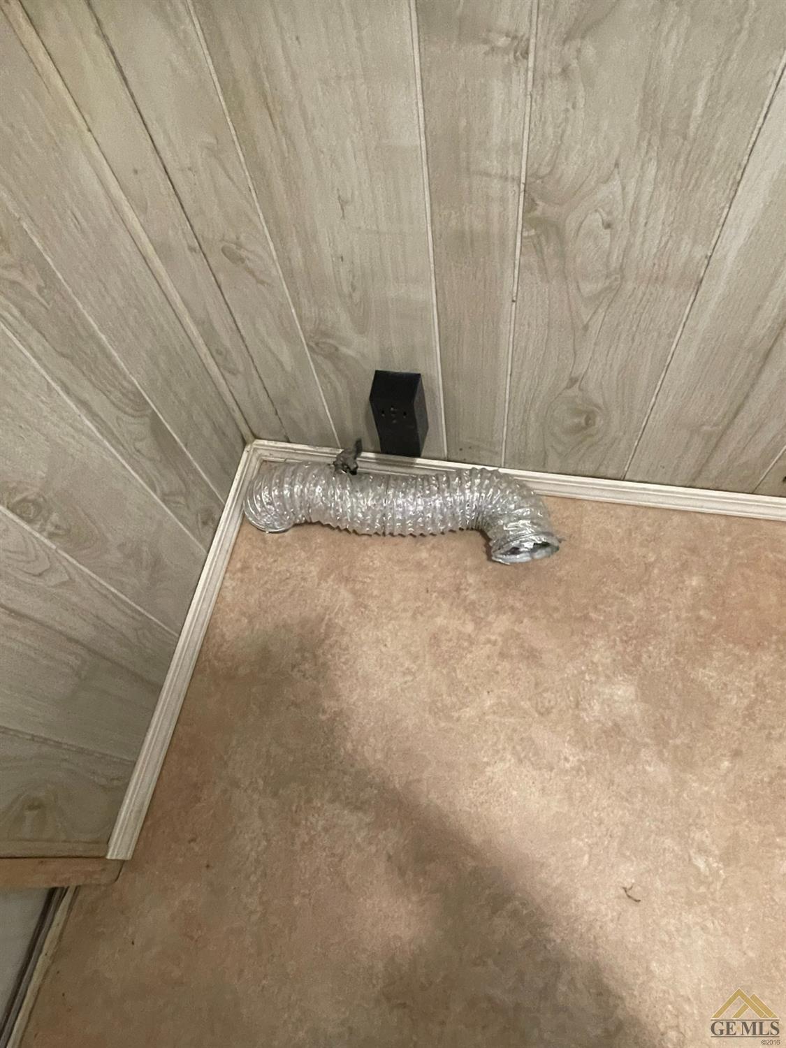 Undisclosed Address Bakersfield, CA 93308 - Photo 38 of 40 a view of a room with a wooden wall