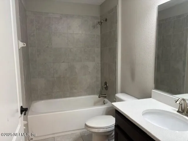 a bathroom with a sink a toilet and a bathtub