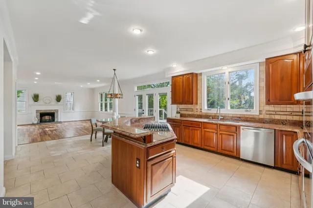 a kitchen with stainless steel appliances granite countertop a sink and cabinets