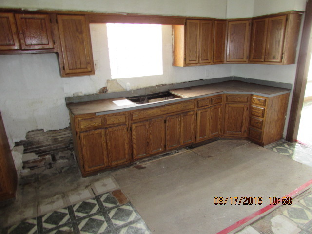 1915 South Pulaski Road Chicago, IL 60623 - Photo 12 of 14 a kitchen with a cabinets and window
