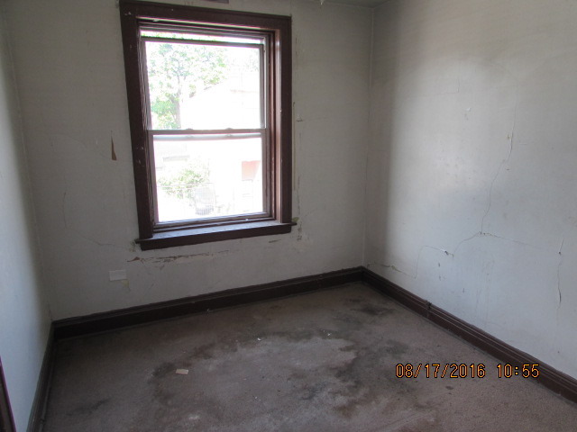 1915 South Pulaski Road Chicago, IL 60623 - Photo 5 of 14 an empty room with a window