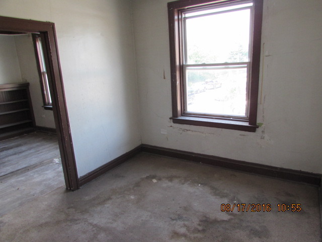 1915 South Pulaski Road Chicago, IL 60623 - Photo 6 of 14 an empty room with a window
