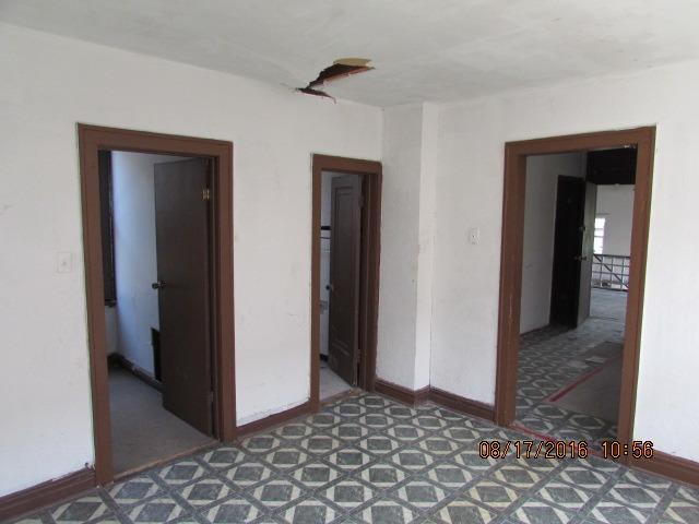 1915 South Pulaski Road Chicago, IL 60623 - Photo 10 of 14 a view of a hallway with wooden floor and closet