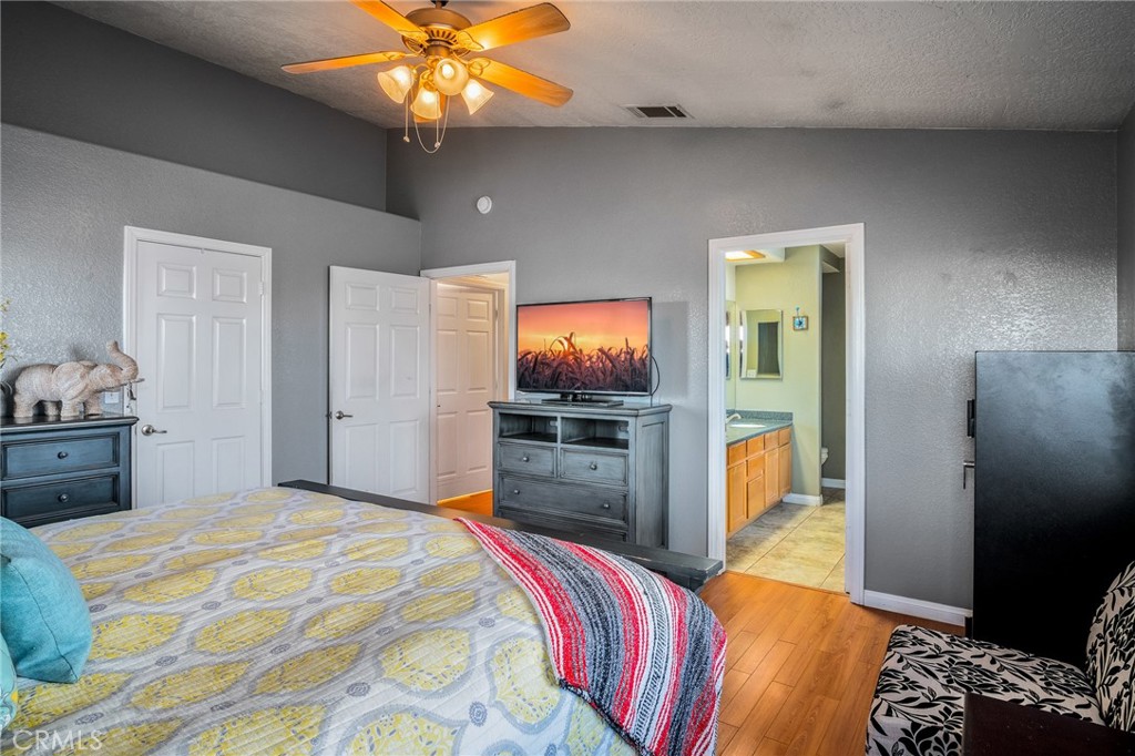 388 Calaveras Road Pinon Hills, CA 92372 - Photo 15 of 44 a bedroom with a bed and a flat screen tv