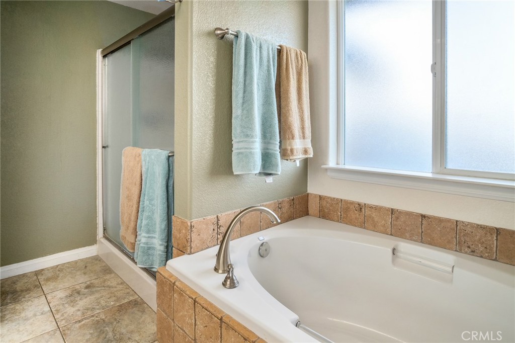 388 Calaveras Road Pinon Hills, CA 92372 - Photo 18 of 44 a bathroom with a tub sink and a window