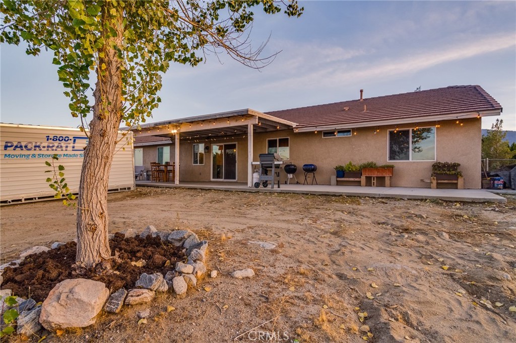 388 Calaveras Road Pinon Hills, CA 92372 - Photo 33 of 44 a front view of a house with a yard