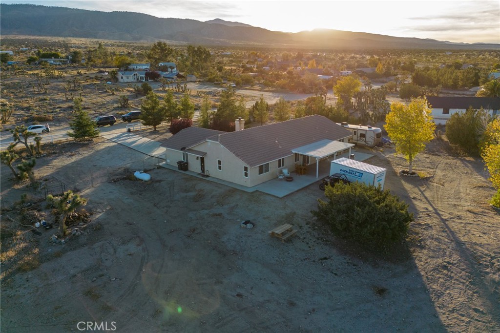 388 Calaveras Road Pinon Hills, CA 92372 - Photo 40 of 44 an aerial view of a house with a mountain
