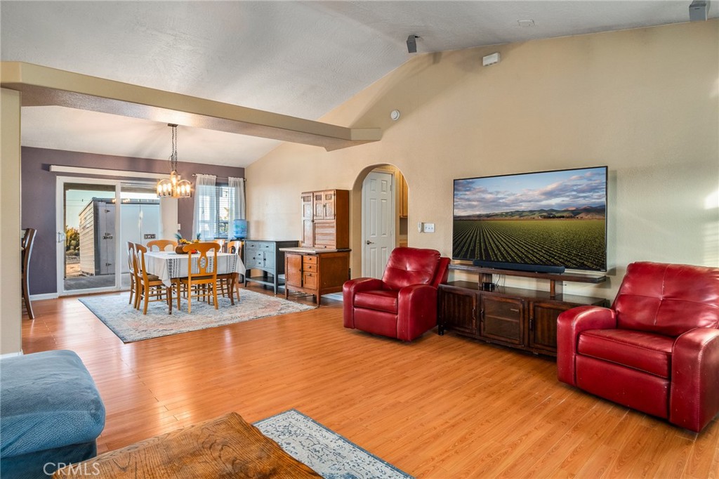 388 Calaveras Road Pinon Hills, CA 92372 - Photo 6 of 44 a living room with furniture and a flat screen tv