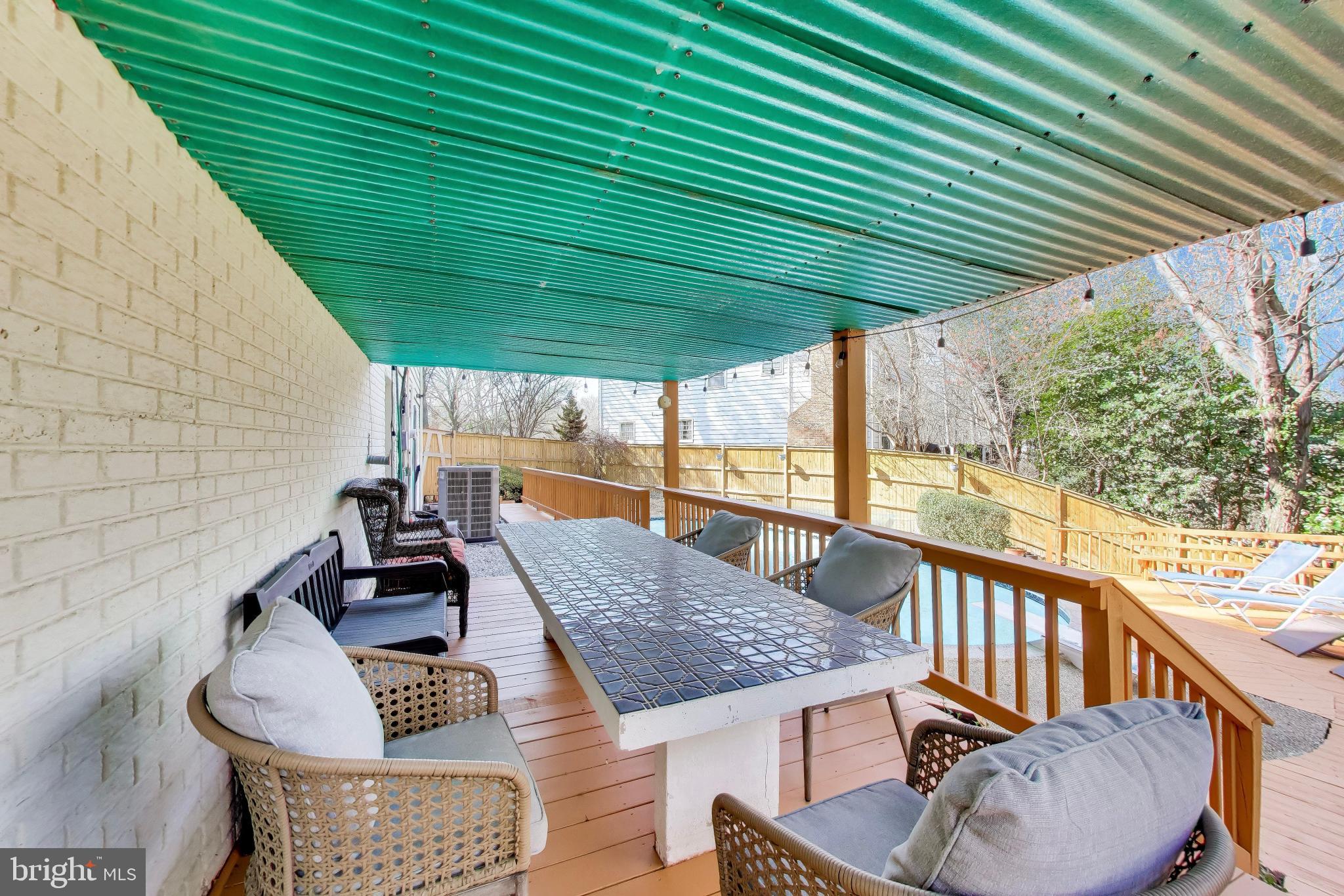 10150 Red Spruce Road Fairfax, VA 22032 - Photo 48 of 70 Lower Covered Deck with Built-In Table