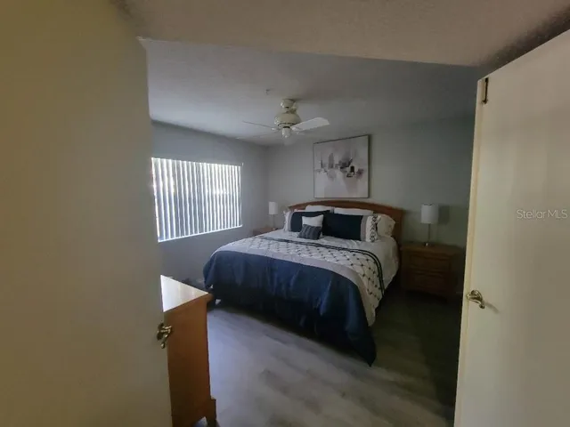 a bedroom with a bed and a window