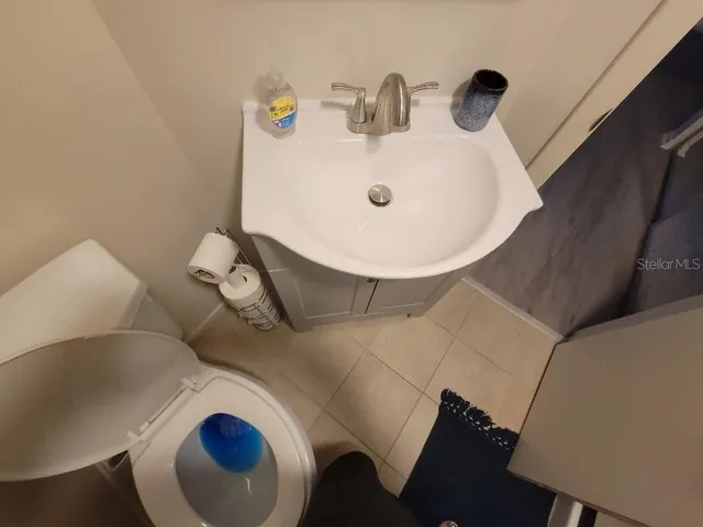 a bed room with a bed and a window