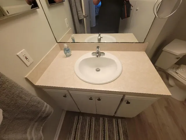 a bedroom with a bed and a television in it