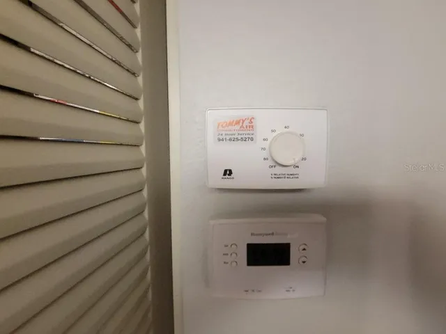 a kitchen with refrigerator cabinets and wooden floor