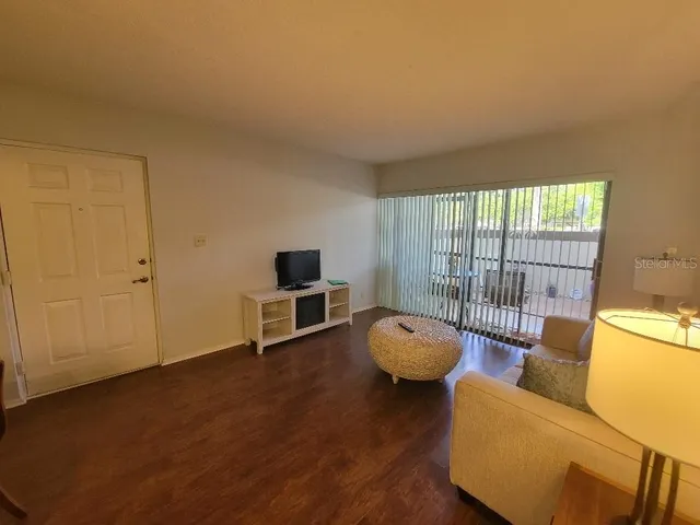 a view of a livingroom with furniture and a couch