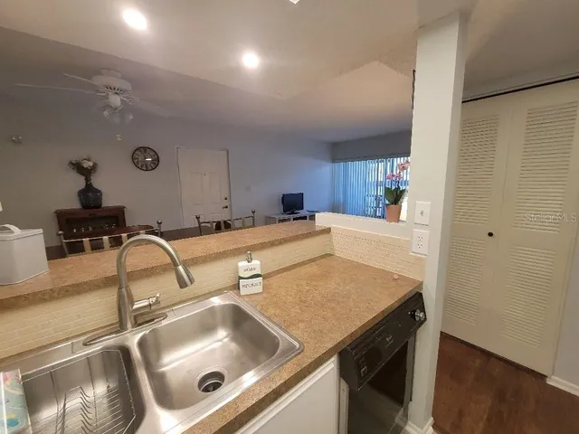 a kitchen with a sink and a refrigerator