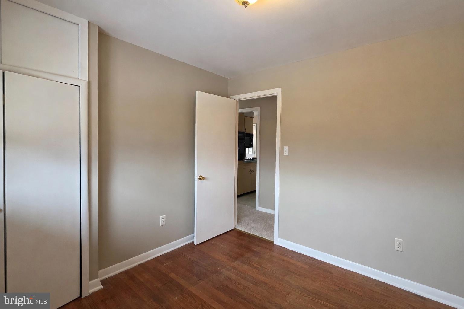 6125 Fishers Station Road Lothian, MD 20711 - Photo 11 of 23 a view of an empty room with wooden floor