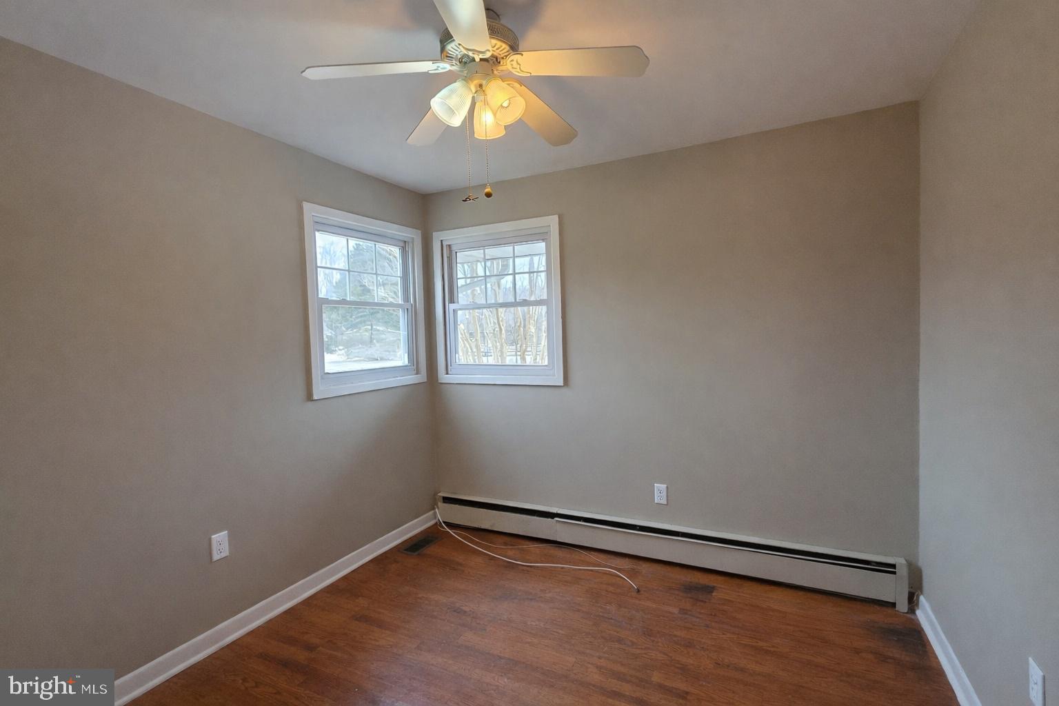 6125 Fishers Station Road Lothian, MD 20711 - Photo 12 of 23 an empty room with windows and fan