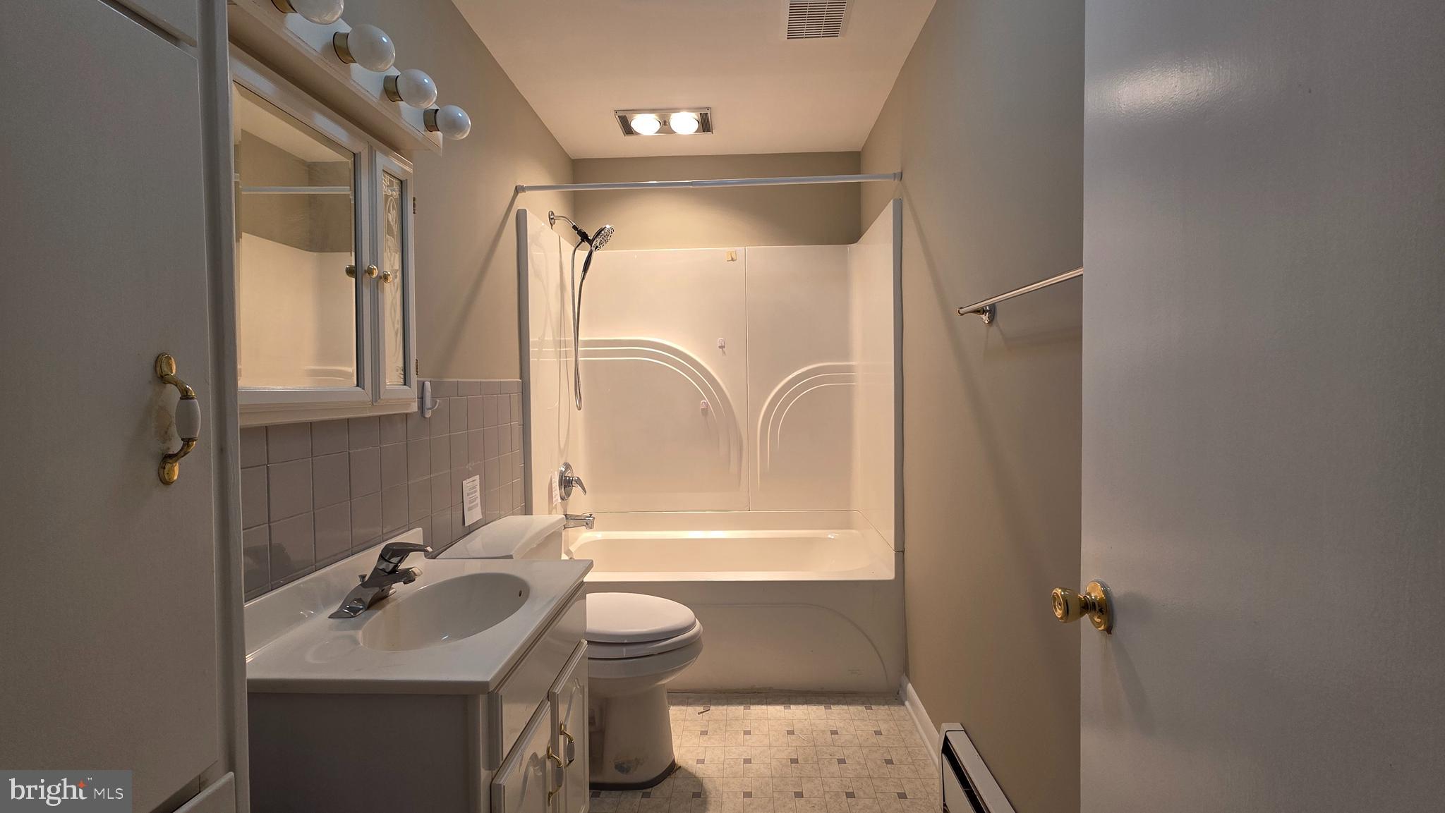 6125 Fishers Station Road Lothian, MD 20711 - Photo 17 of 23 a bathroom with a sink toilet and shower