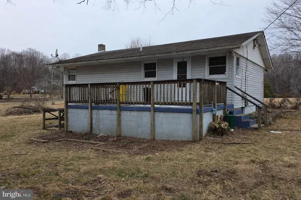 a house with trees in the background
