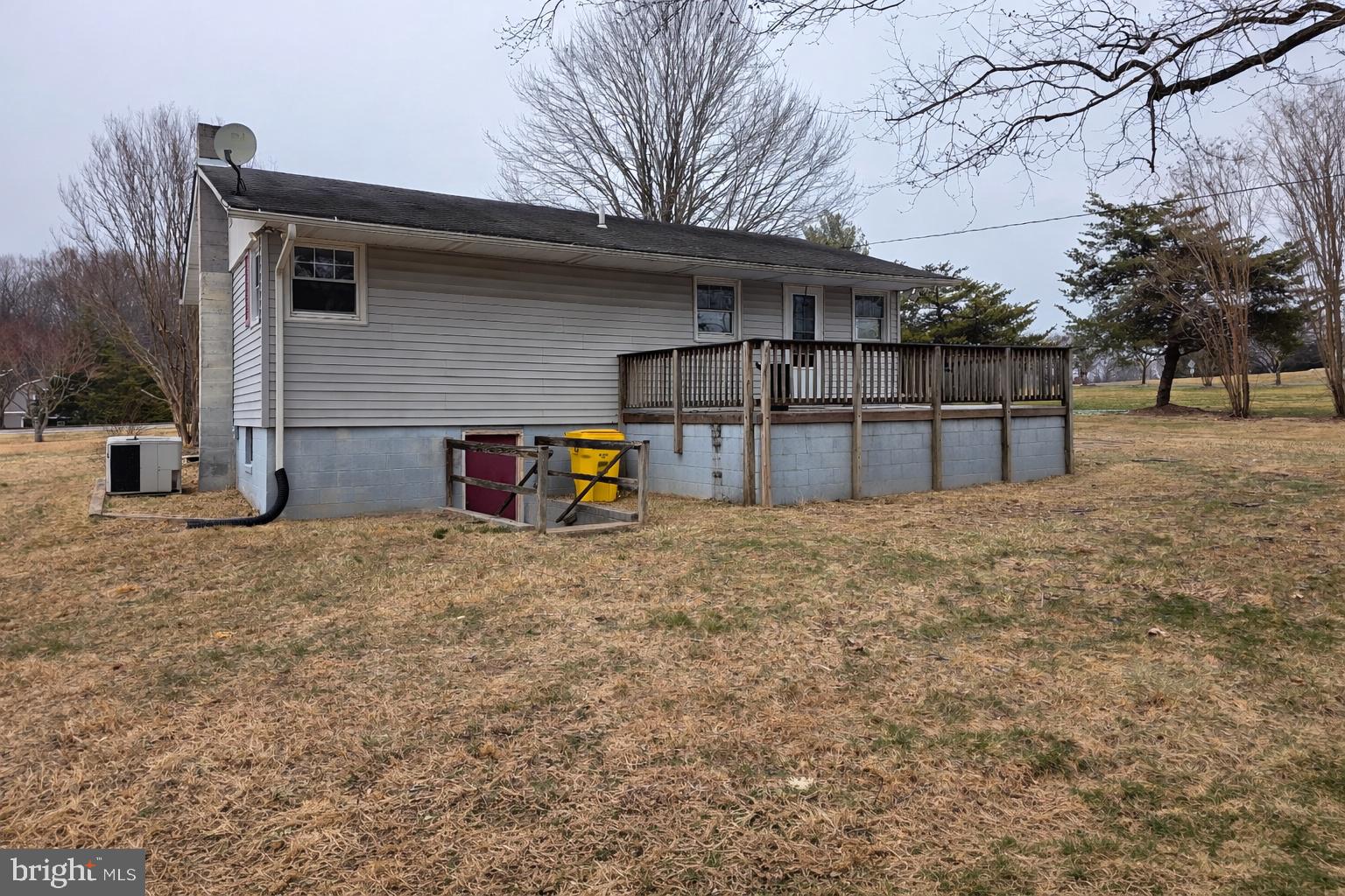 6125 Fishers Station Road Lothian, MD 20711 - Photo 22 of 23 a house with trees in the background