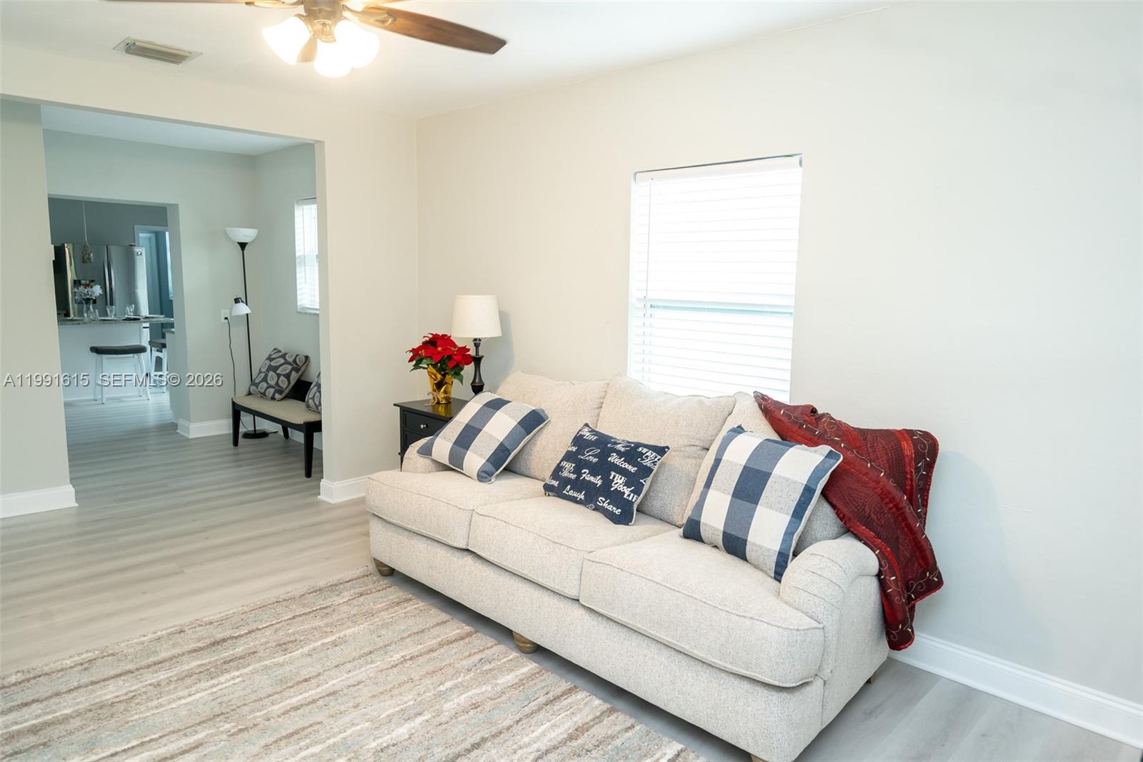 2230 Southwest 60th Court Miami, FL 33155 - Photo 5 of 35 a living room with furniture and a wooden floor
