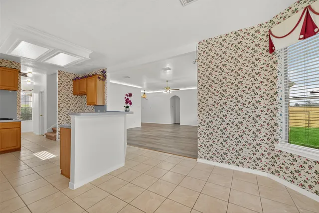 a view of kitchen with furniture and a refrigerator