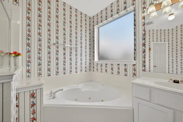 a bathroom with a bathtub and shower