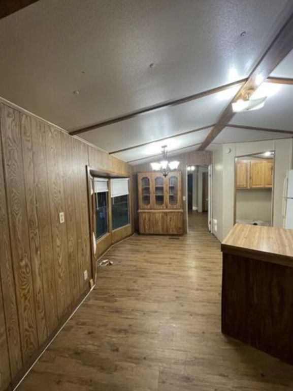 410 North Street Kyle, TX 78640 - Photo 4 of 7 a view of a room with wooden floor