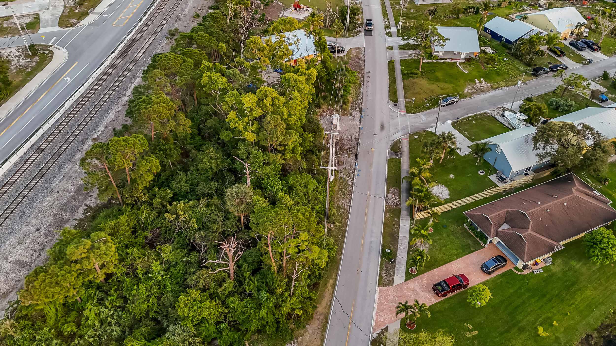 4959 Southeast Primrose Way Stuart, FL 34997 - Photo 2 of 12 an aerial view of green landscape with outdoor space
