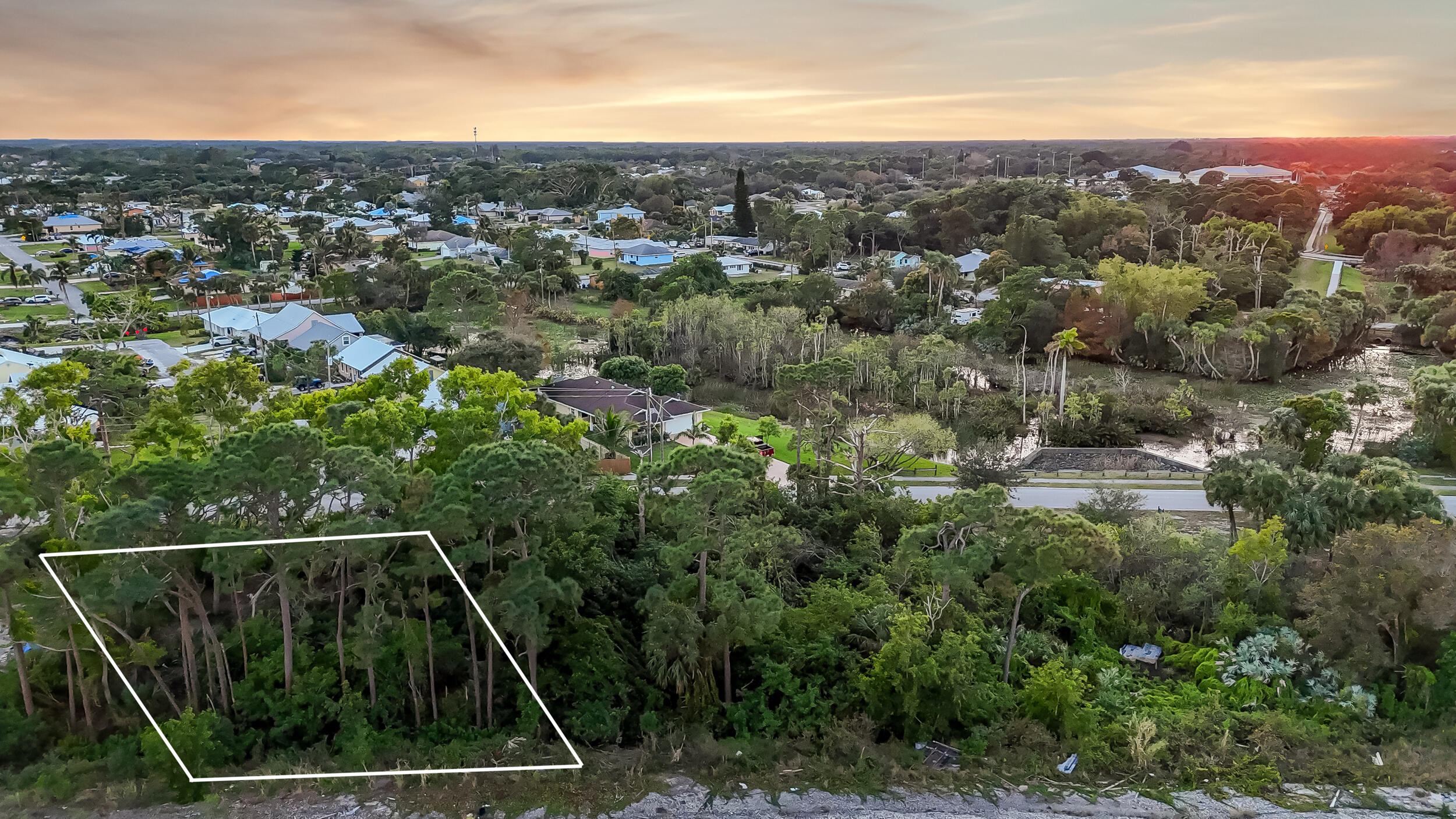 4959 Southeast Primrose Way Stuart, FL 34997 - Photo 7 of 12 an aerial view of residential houses with outdoor space and trees