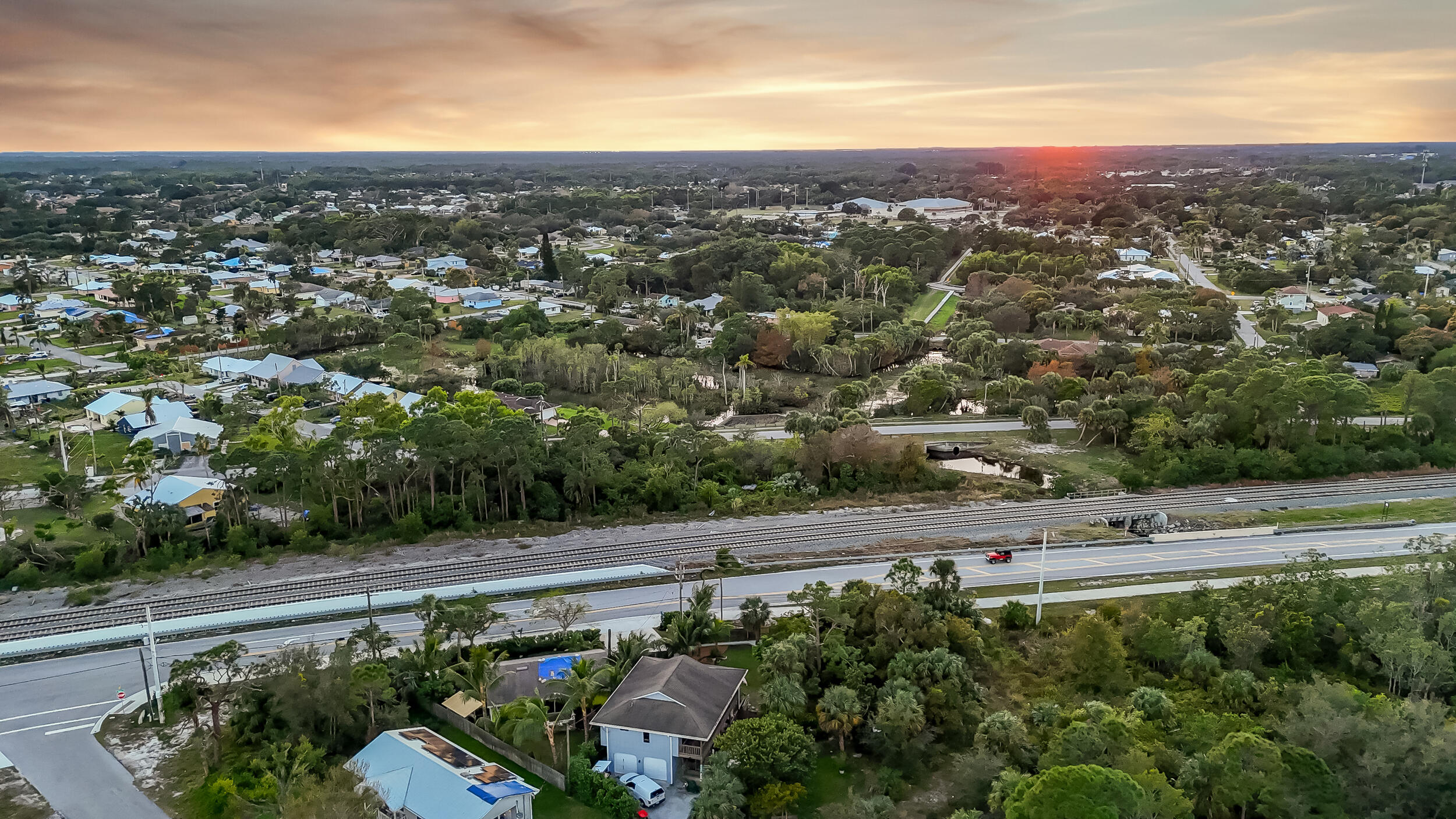 4959 Southeast Primrose Way Stuart, FL 34997 - Photo 9 of 12 an aerial view of a city