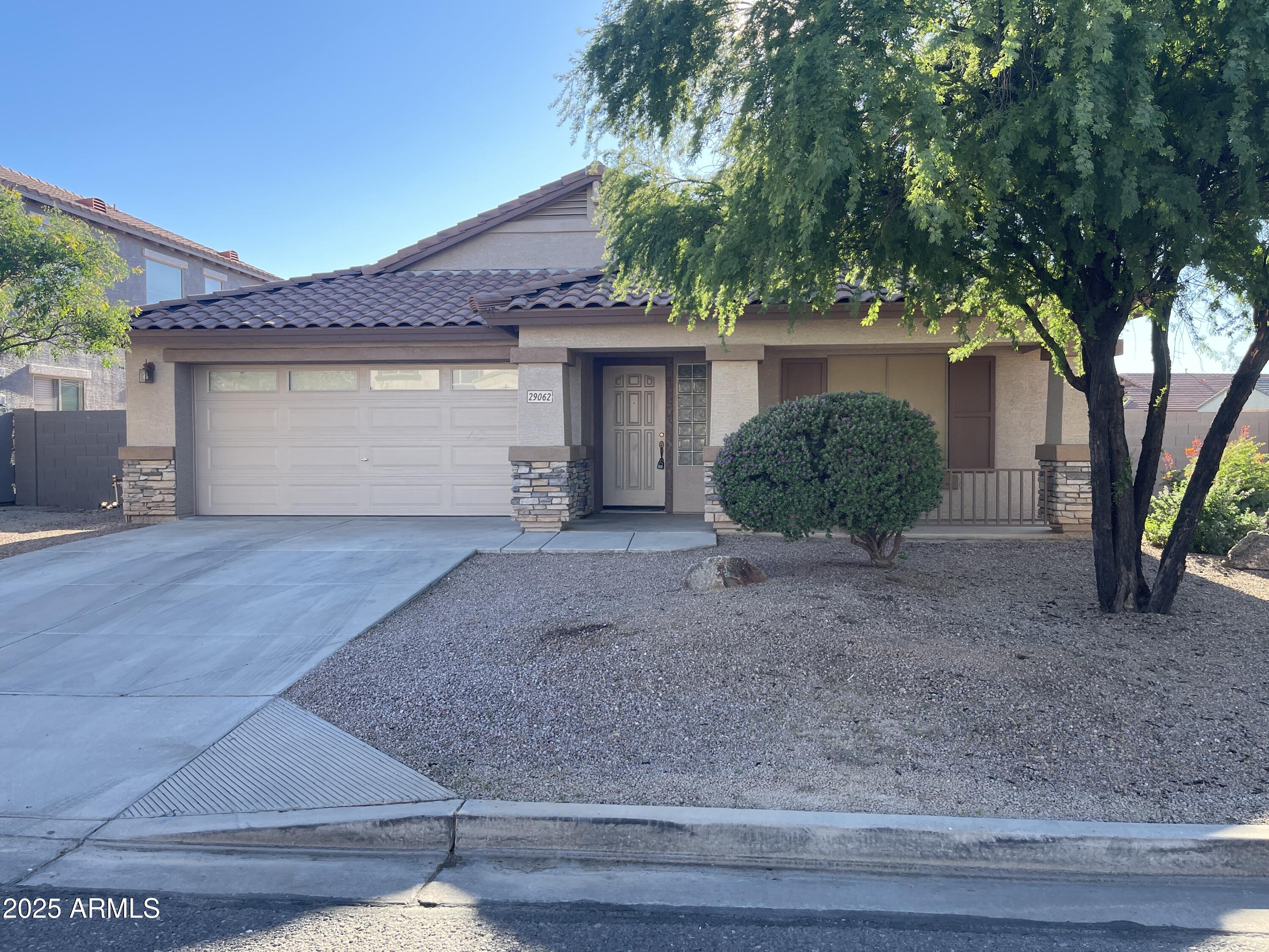 29062 North Mountain View Road San Tan Valley, AZ 85143 - Photo 1 of 16 a view of a house with a yard and large tree