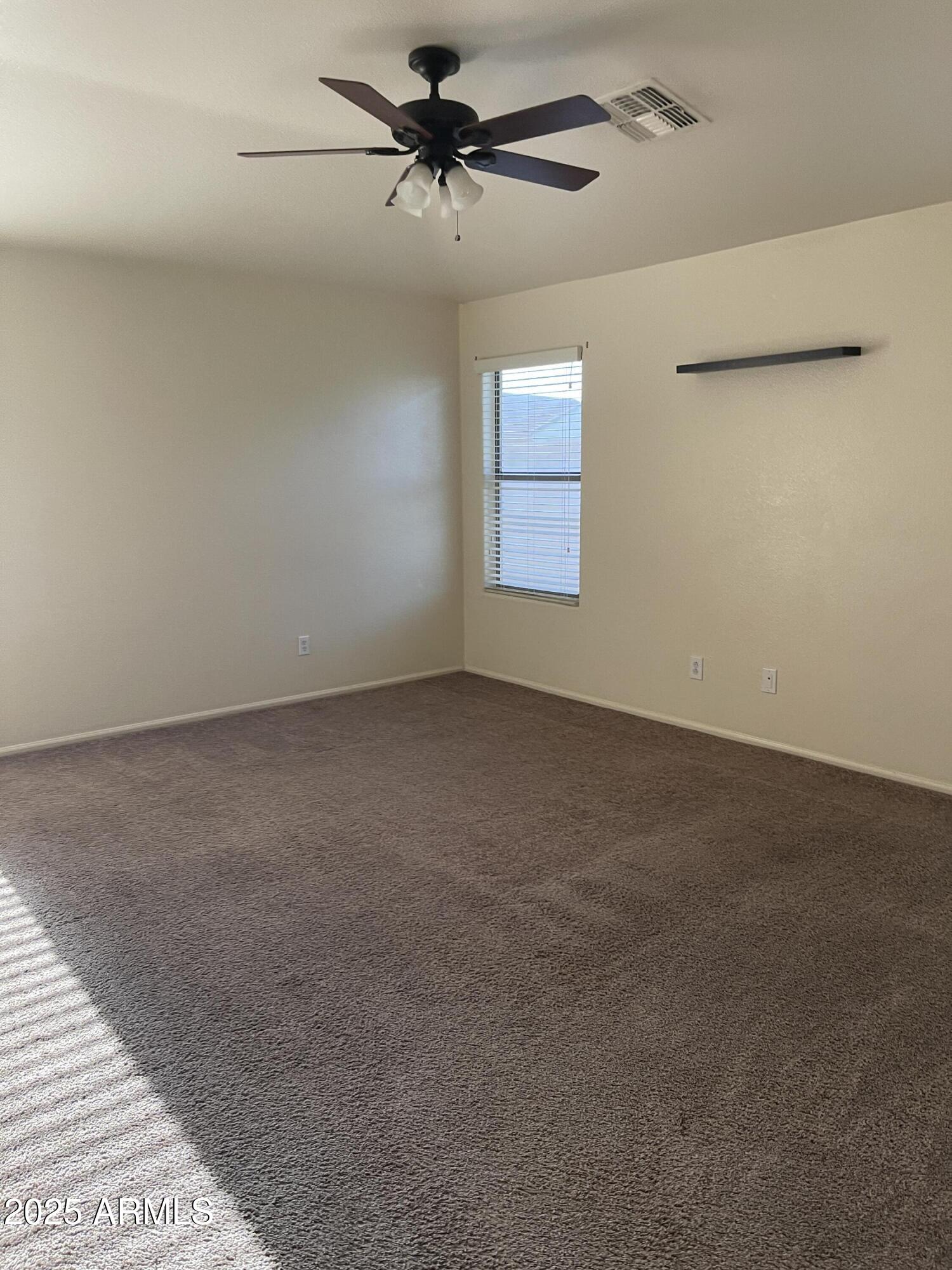 29062 North Mountain View Road San Tan Valley, AZ 85143 - Photo 12 of 16 a view of a livingroom with a ceiling fan and window