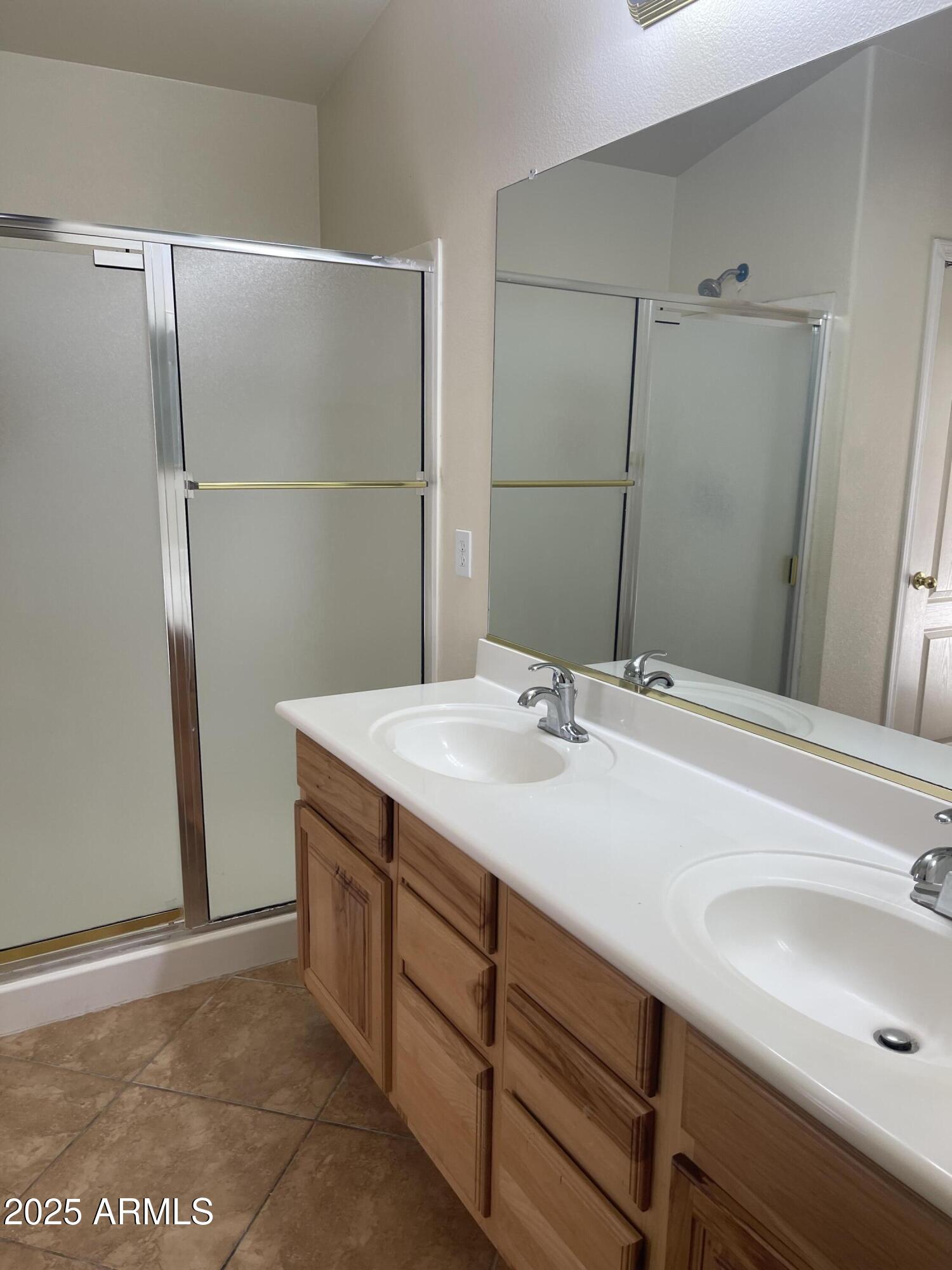 29062 North Mountain View Road San Tan Valley, AZ 85143 - Photo 14 of 16 a bathroom with a sink and a mirror