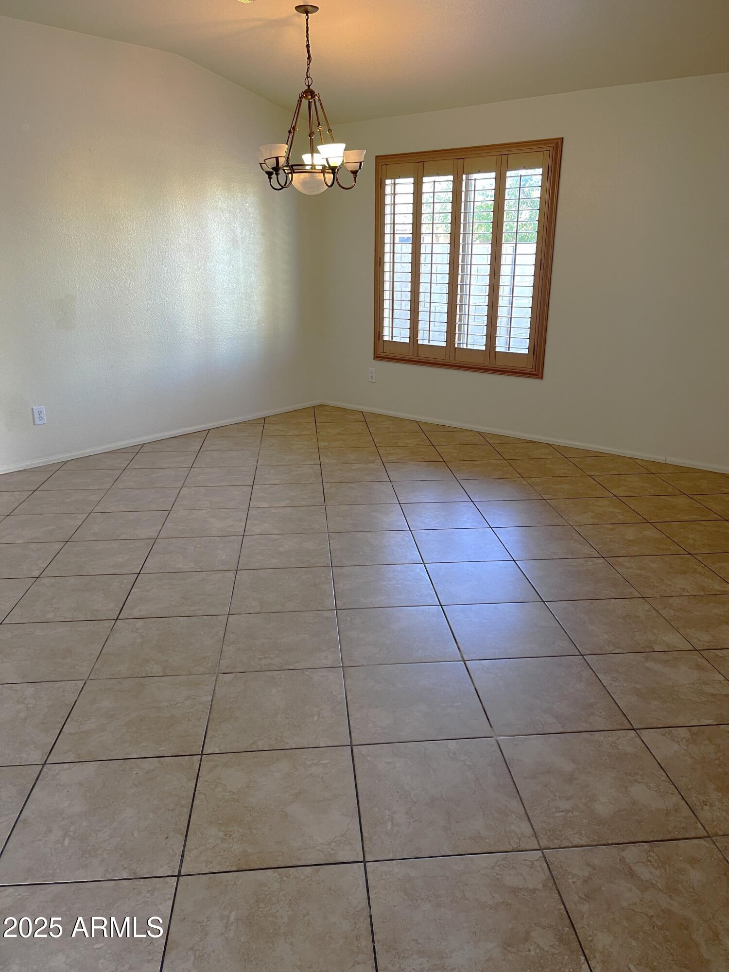 29062 North Mountain View Road San Tan Valley, AZ 85143 - Photo 2 of 16 a view of an empty room with a window