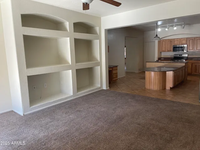 a view of a kitchen with a sink and cabinets