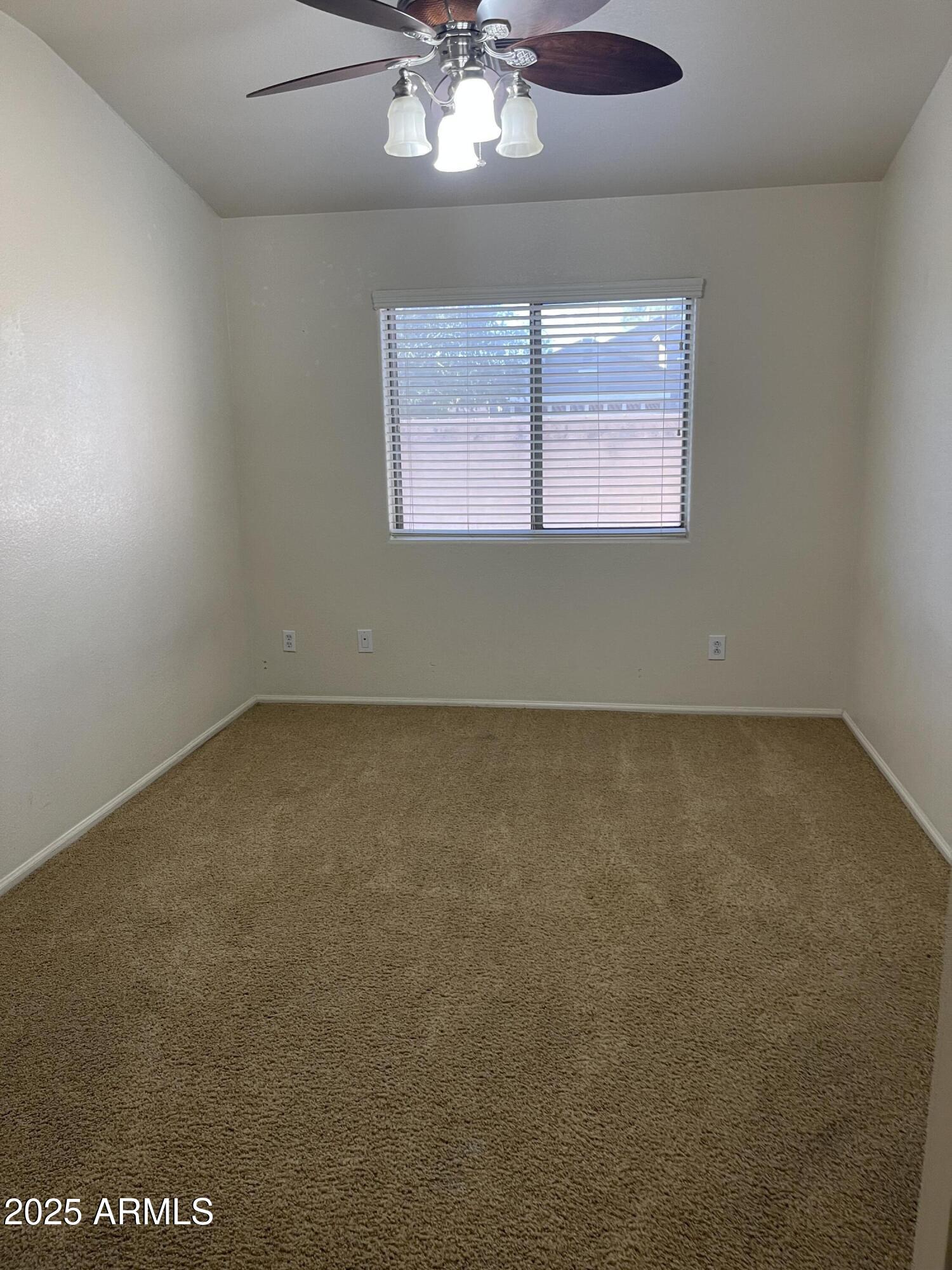 29062 North Mountain View Road San Tan Valley, AZ 85143 - Photo 6 of 16 an empty room with a window