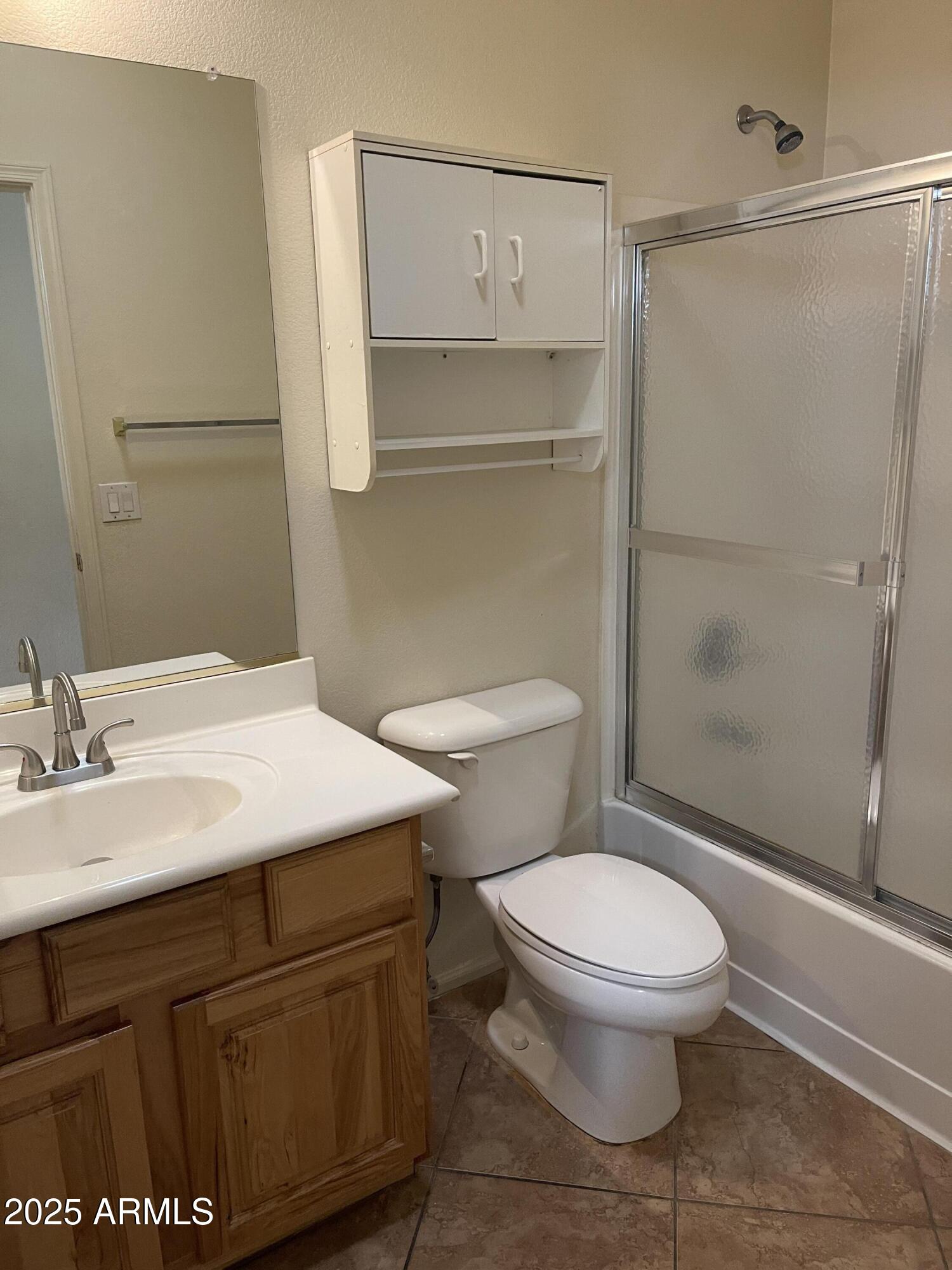 29062 North Mountain View Road San Tan Valley, AZ 85143 - Photo 8 of 16 a bathroom with a sink a toilet and shower