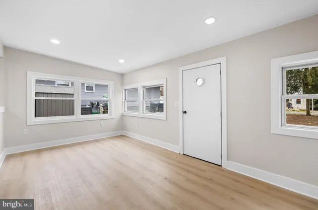 a living room with furniture or window and a potted plant