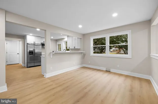 a view of a kitchen with a sink and cabinets