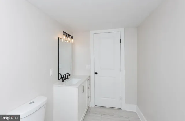 a bathroom with a sink a mirror and shower