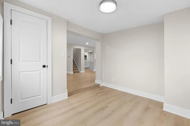 a kitchen with a refrigerator sink and cabinets